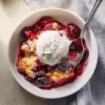 Easy Batter Fruit Cobbler with golden crust and berries