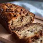 Chocolate chip banana bread loaf sliced with melty chocolate