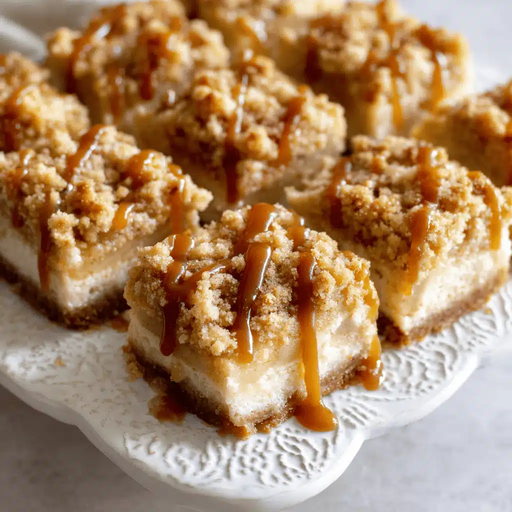 Caramel apple cheesecake bars cut into squares and served with caramel drizzle