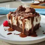 Homemade chocolate Ice Cream Cake with creamy layers and drizzle