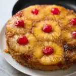 pineapple upside down cake with caramelized pineapple rings and cherries
